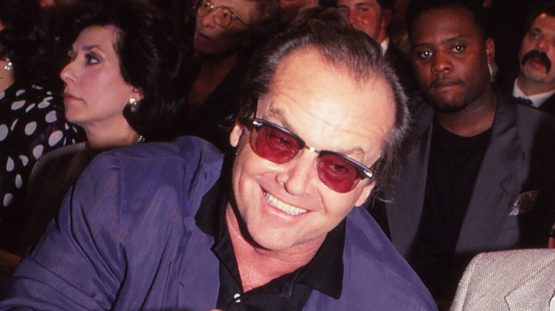 Jack Nicholson wearing red tinited sunglasses