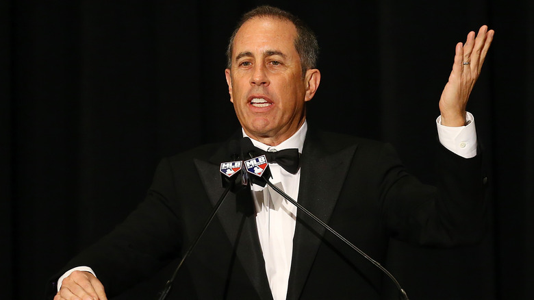 Jerry Seinfeld speaking at podium