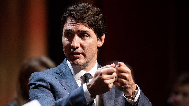 Justin Trudeau holding up his hands