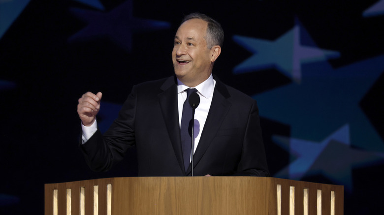 Doug Emhoff speaking on stage during the second day of the Democratic National Convention at the United Center