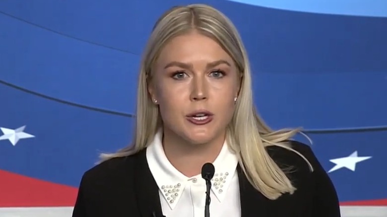 Karoline Leavitt talks into the microphone at the 2022 New Hampshire congressional debate