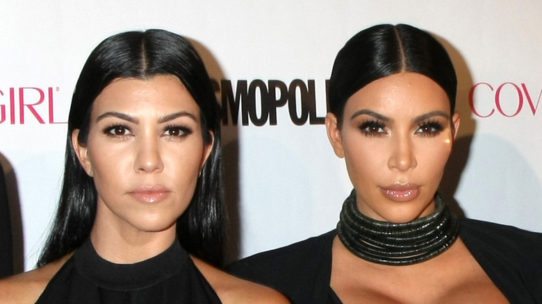 Kim posing with Kourtney Kardashian
