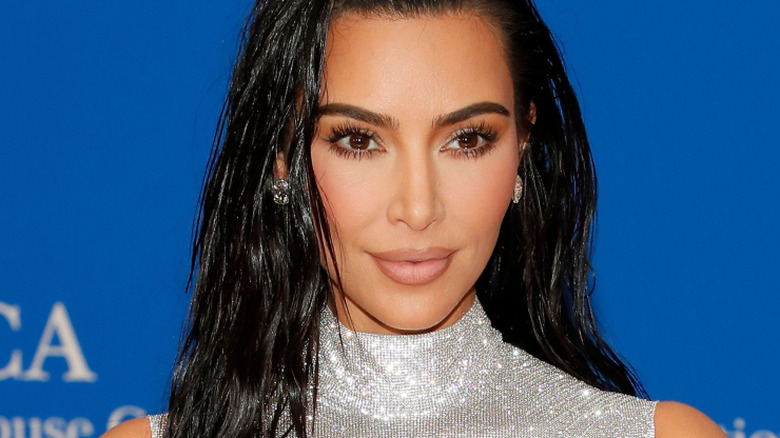 Kim Kardashian posing in silver