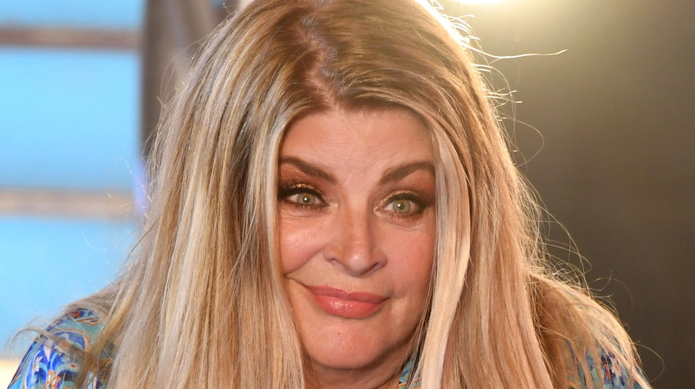 Kirstie Alley shrugging