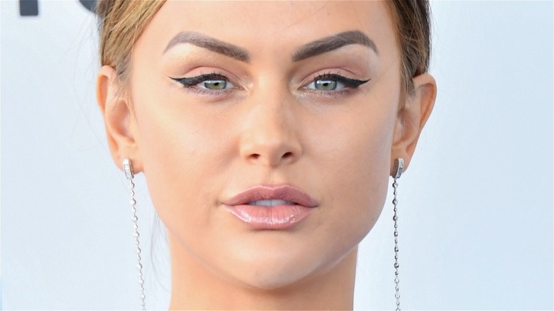 Lala Kent in closeup wearing dangly earings