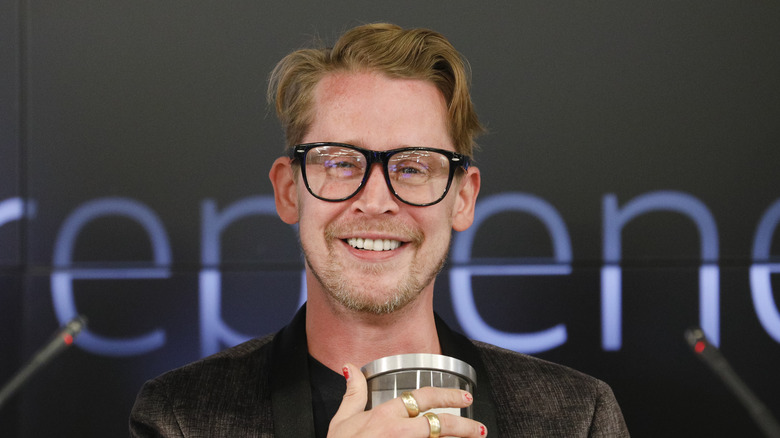 Macaulay Culkin posing for cameras