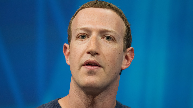 Mark Zuckerberg speaking blue background
