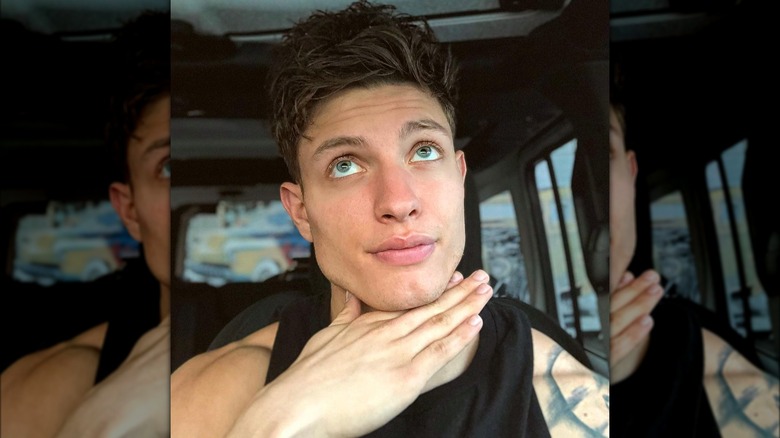 Matt Rife with chin on hand