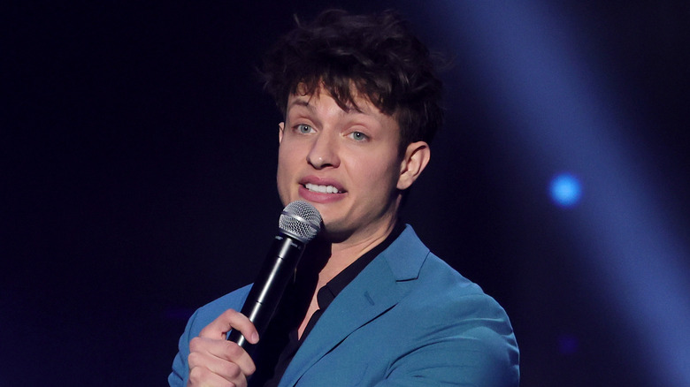 Matt Rife holding microphone