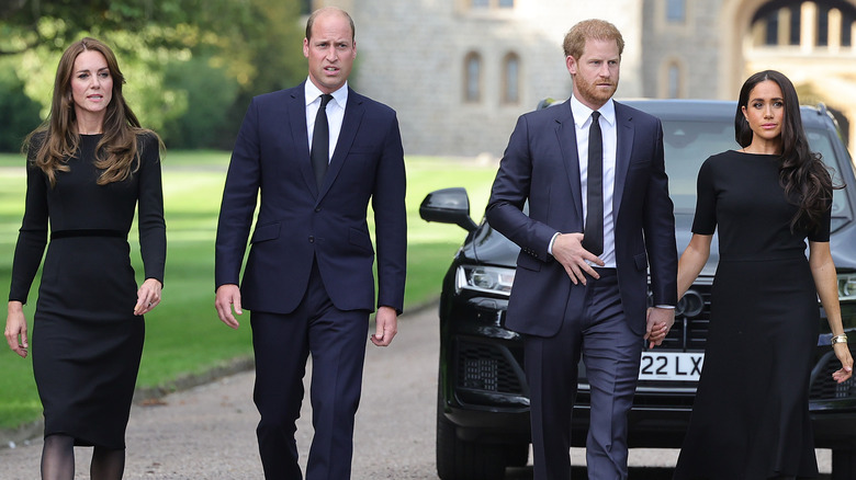 Kate Middleton, Prince William, Prince Harry, and Meghan Markle walking