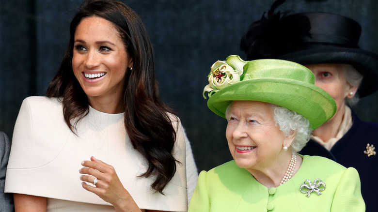 Meghan Markle and Queen Elizabeth, both smiling