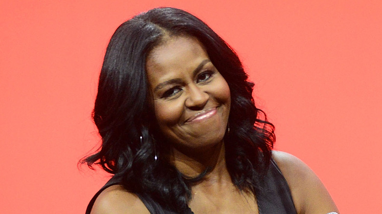 Michelle Obama smiling head tilted 