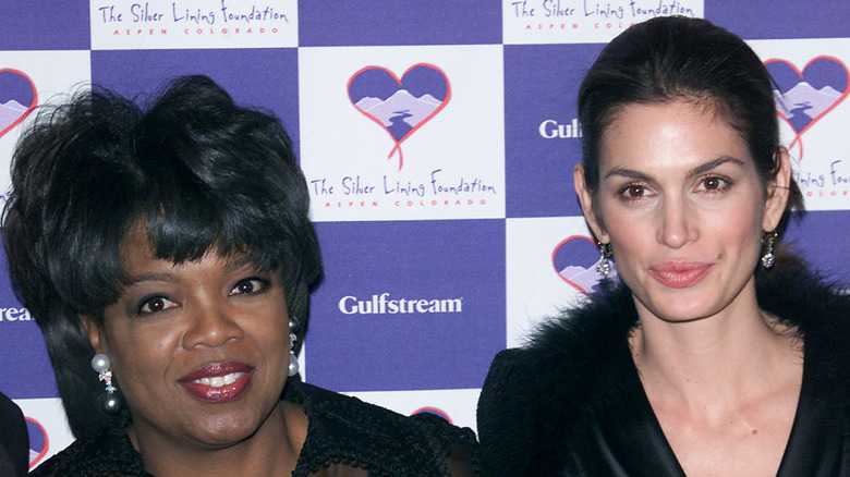 Oprah Winfrey and Cindy Crawford posing