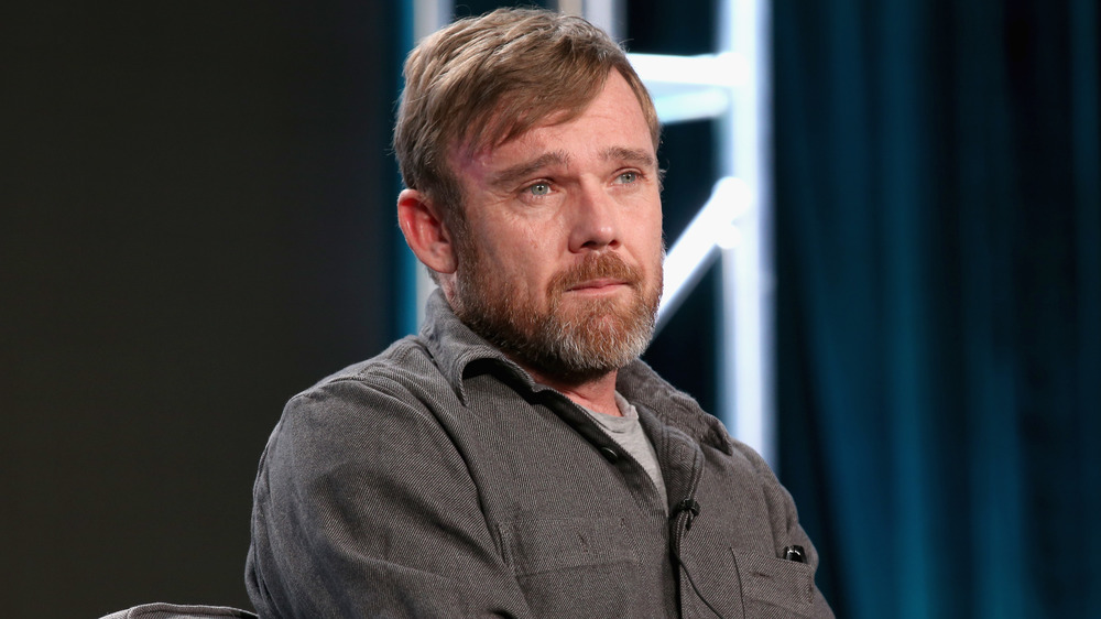 Ricky Schroder seated