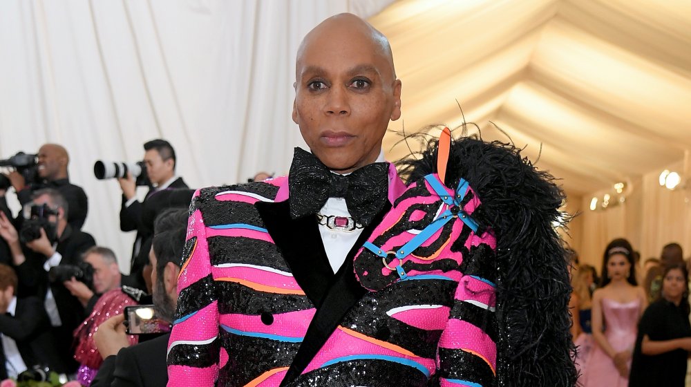 RuPaul in a sequinned black and pink blazer