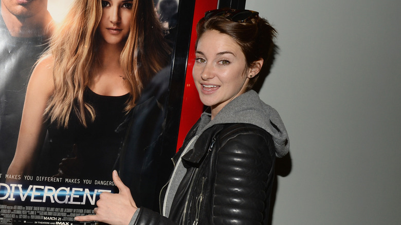 Shailene Woodley with 'Divergent' poster