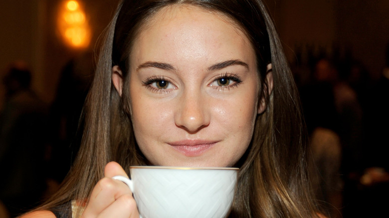Shailene Woodley holding teacup
