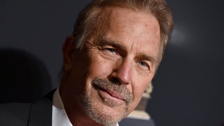 Kevin Costner posing for cameras