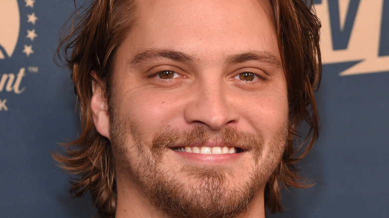 Luke Grimes posing for cameras