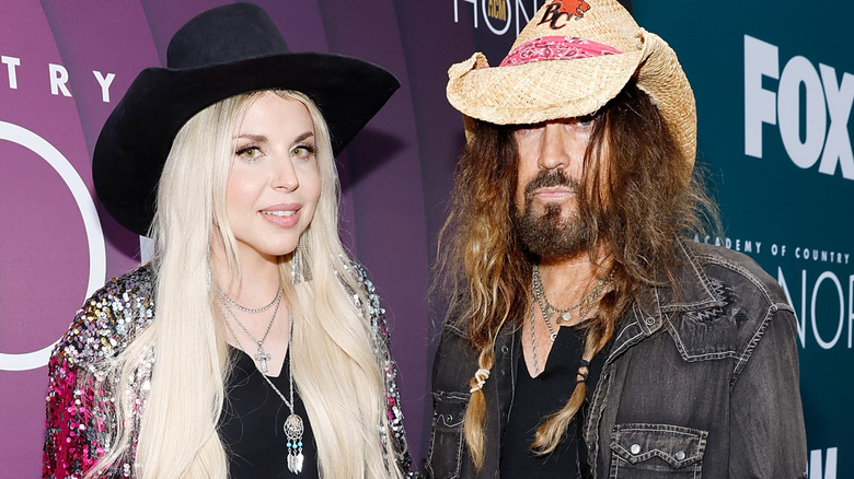 Firerose and Billy Ray Cyrus on red carpet