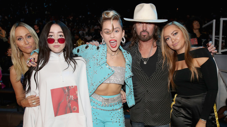 The Cyrus family posing for a photograph