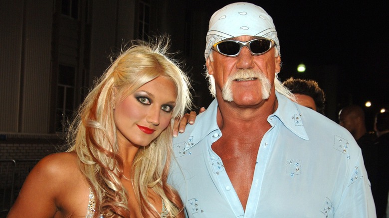 Brooke Hogan leans on her dad, Hulk Hogan, for a picture.