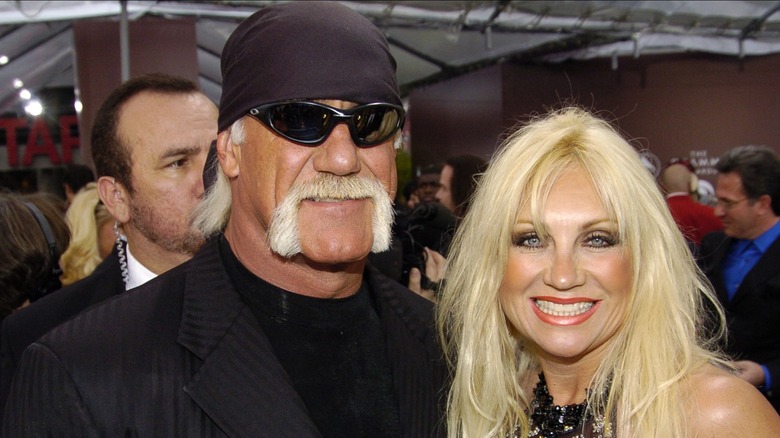 Hulk Hogan and Linda Hogan smile beside each other at the Grammys