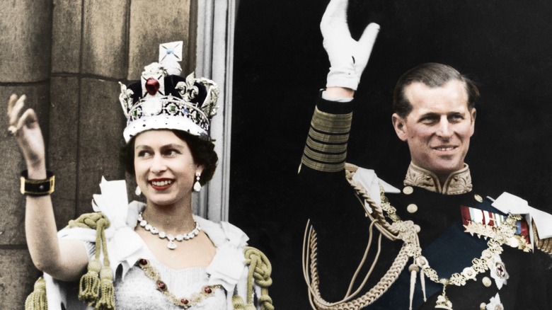 Queen Elizabeth and Prince Philip waving