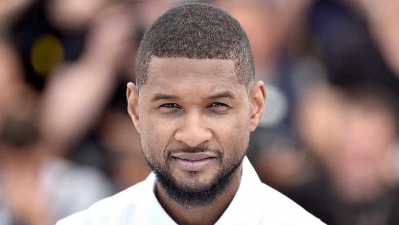 Usher in white suit