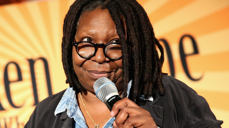 Whoopi Goldberg speaking at an event 