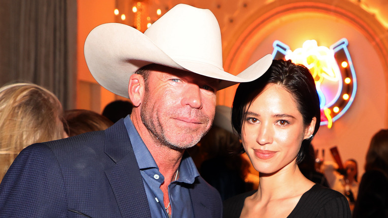 Taylor Sheridan poses with Kelsey Asbille in 2022