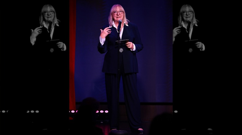 Donna Kelce speaking at a microphone
