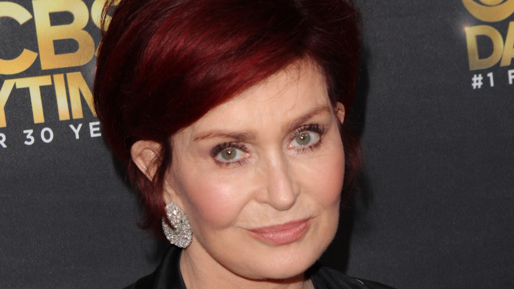 Sharon Osbourne smirking