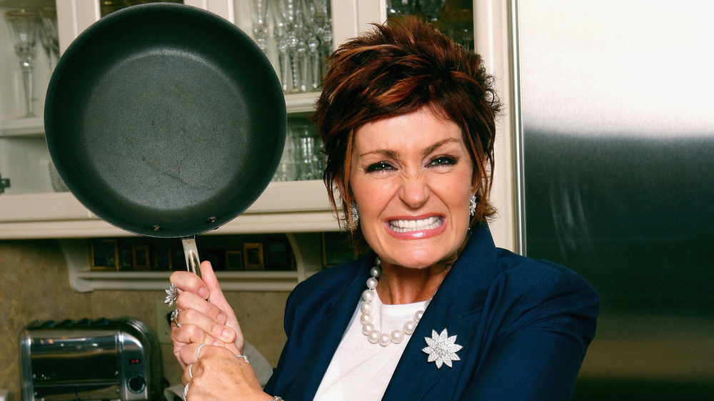Sharon Osbourne holding frying pan