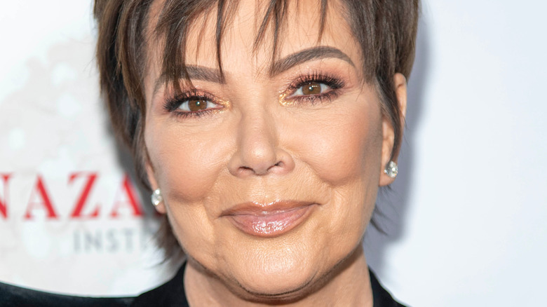 Kris Jenner with hair in eyes