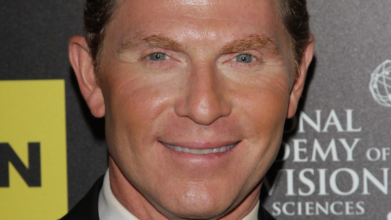 Bobby Flay smiling tan red carpet