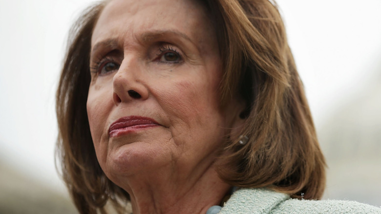 Nancy Pelosi in a pink suit