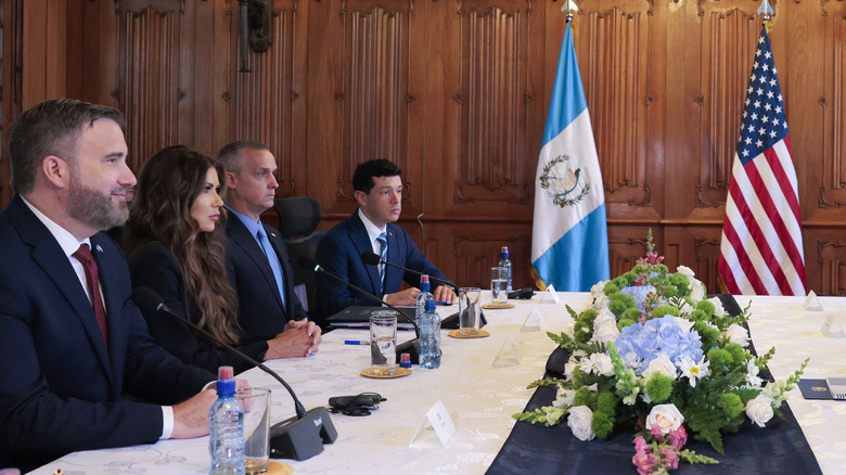 Kristi Noem sits next to Corey Lewandowski in June 2025