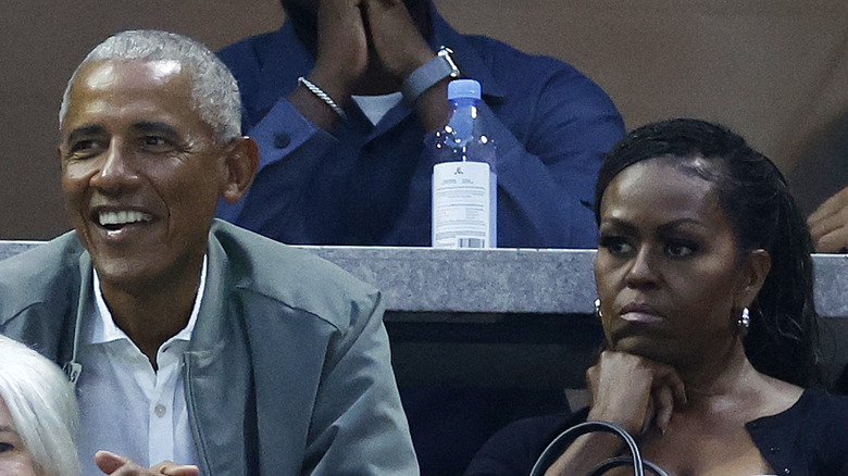Barack Obama and Michelle Obama watching tennis