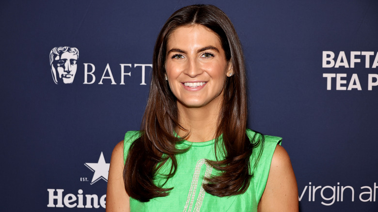 Kaitlan Collins posing and smiling