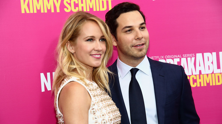 Anna Camp Skylar Astin pink background