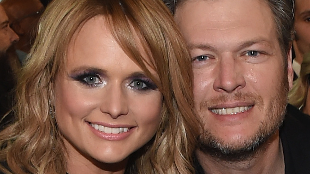 Miranda Lambert and Blake Shelton sitting together