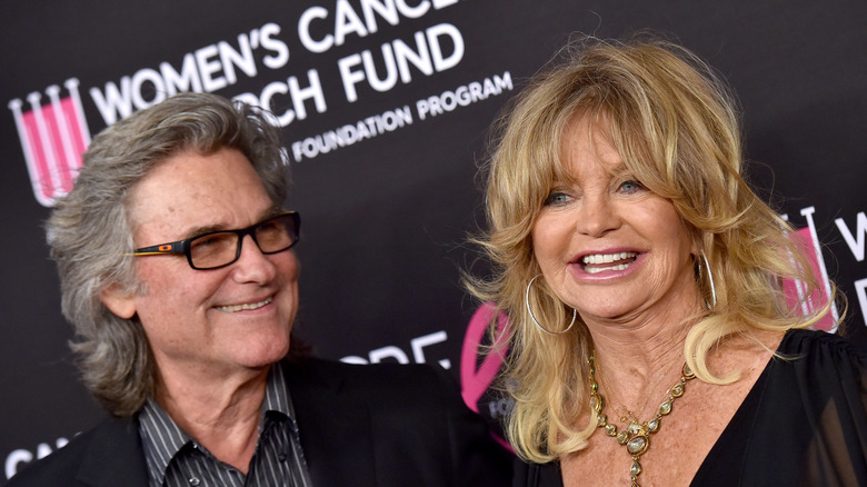 Kurt Russell looking at Goldie Hawn
