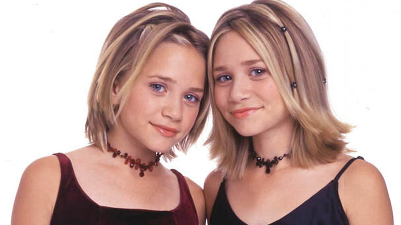 Mary-Kate and Ashley Olsen smiling