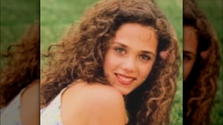 Elizabeth Berkley posing