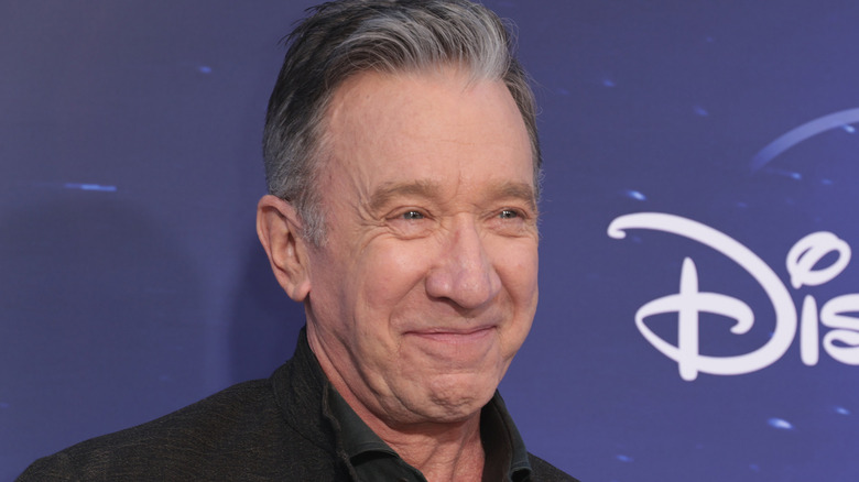 Tim Allen smiles at a public event