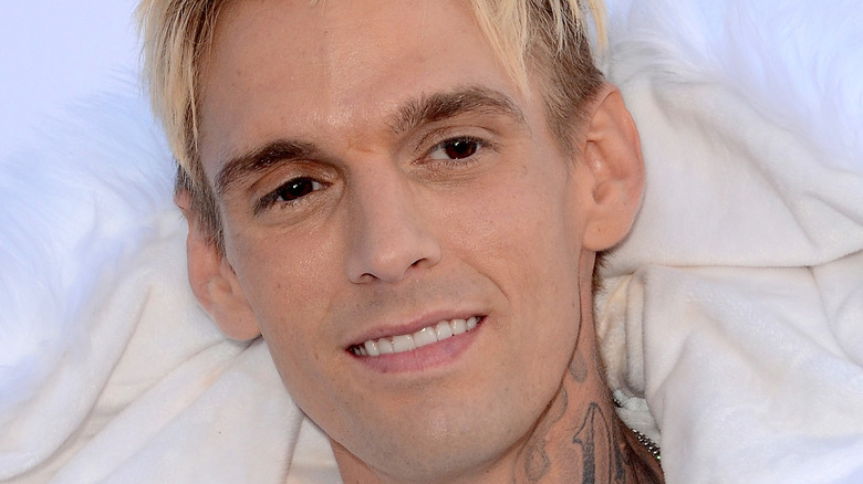 Aaron Carter neck tattoo smiling blond