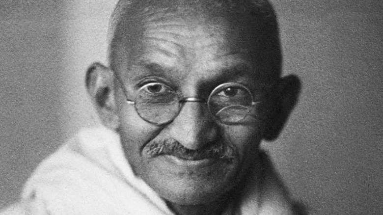 Mahatma Gandhi looking on