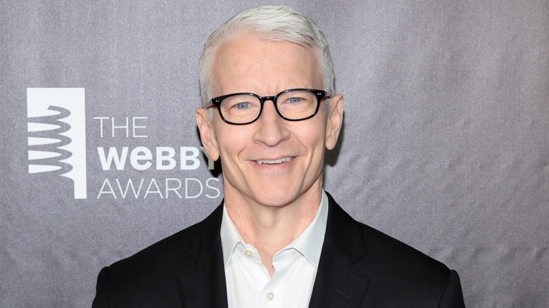 Anderson Cooper smiling with glasses on