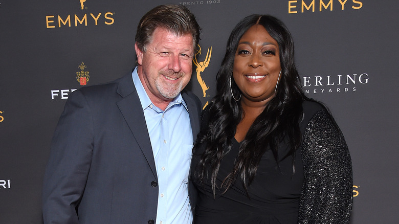 Loni Love and James Welsh at event 